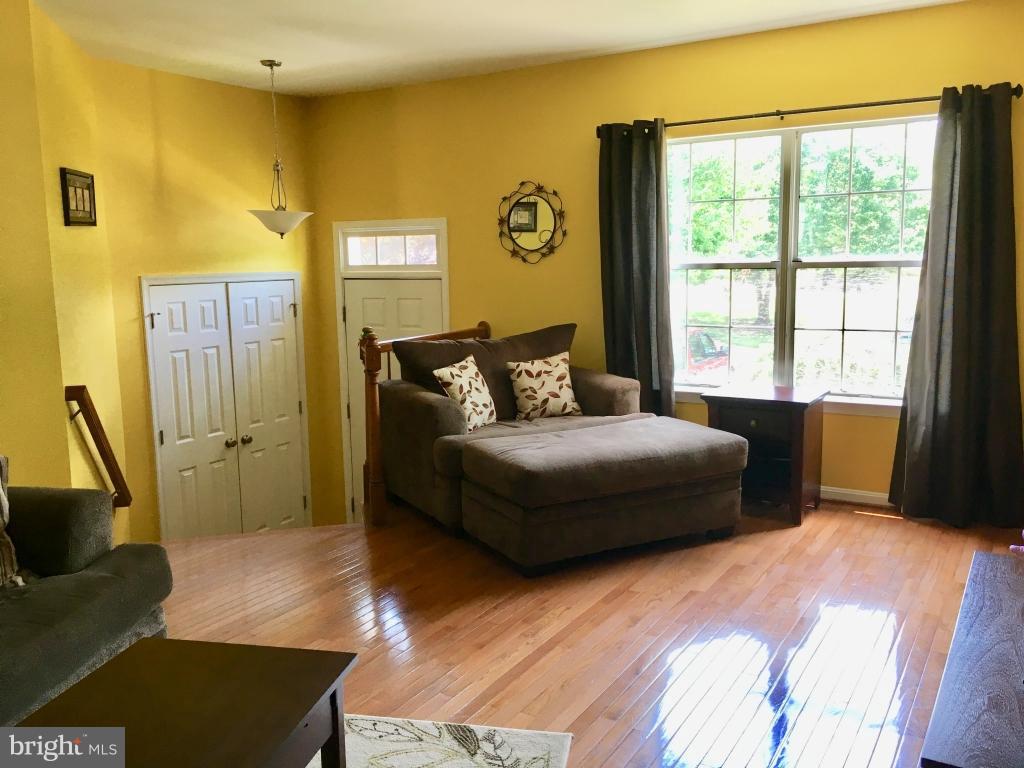 202 Rugby Road Fredericksburg, VA 22406 - Photo 3 of 29 a bedroom with a bed and wooden floor