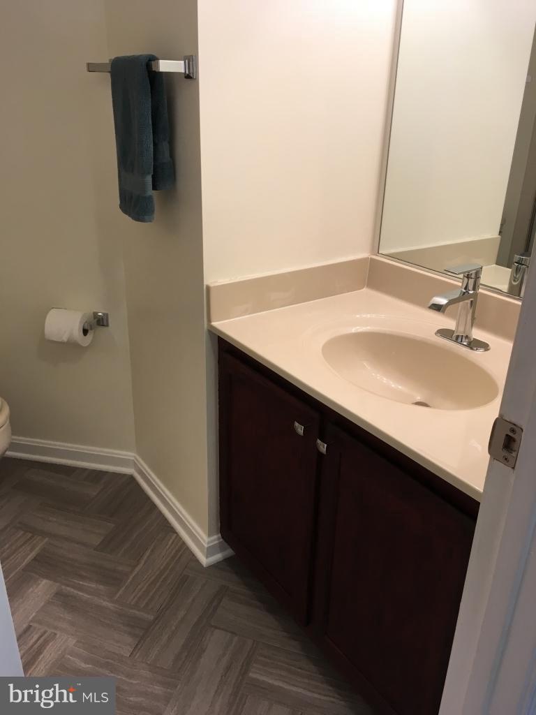 202 Rugby Road Fredericksburg, VA 22406 - Photo 22 of 29 a bathroom with a sink and mirror