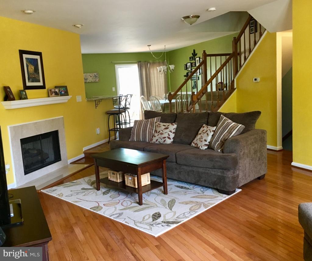 202 Rugby Road Fredericksburg, VA 22406 - Photo 8 of 29 a living room with furniture and a wooden floor