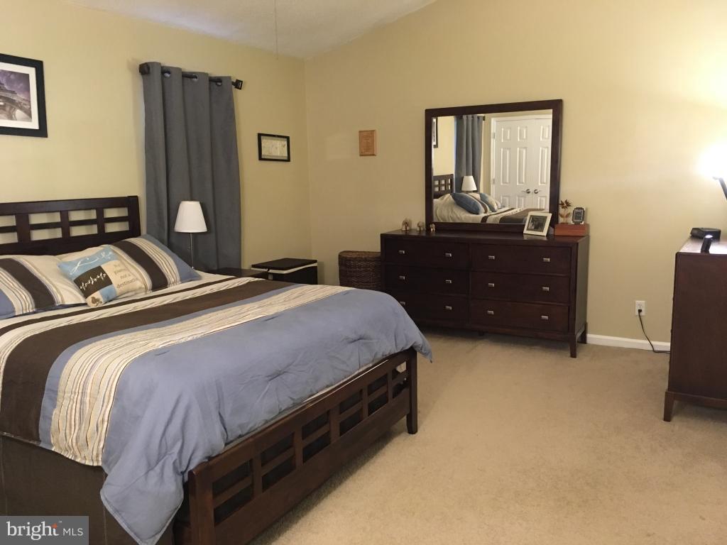 202 Rugby Road Fredericksburg, VA 22406 - Photo 10 of 29 a bedroom with a bed and a mirror