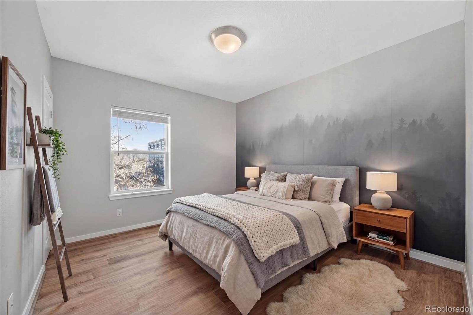 2389 South High Street, Unit 4 Denver, CO 80210 - Photo 11 of 32 a bedroom with a bed wall painting and a window