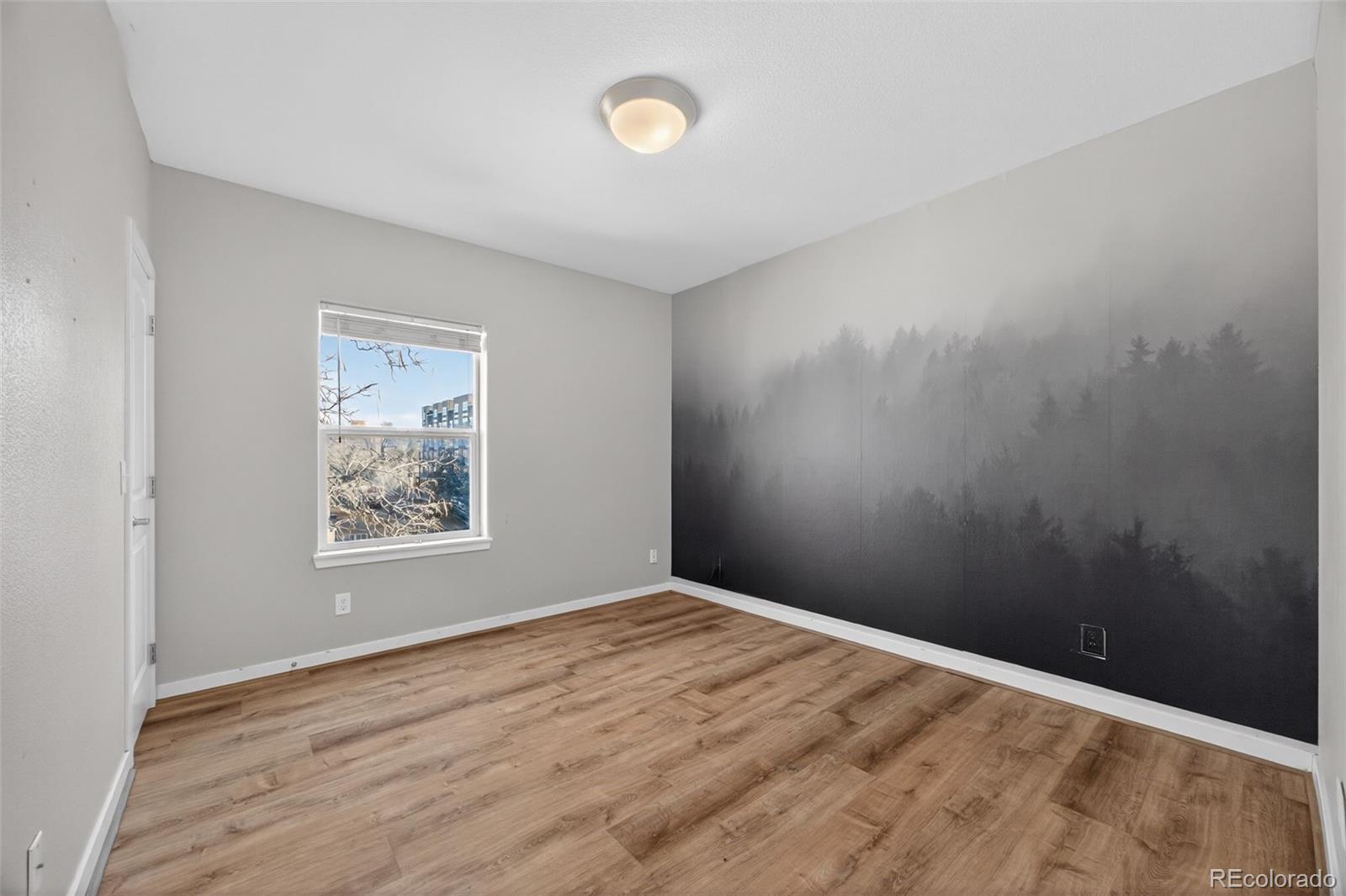 2389 South High Street, Unit 4 Denver, CO 80210 - Photo 12 of 32 a view of empty room with wooden floor