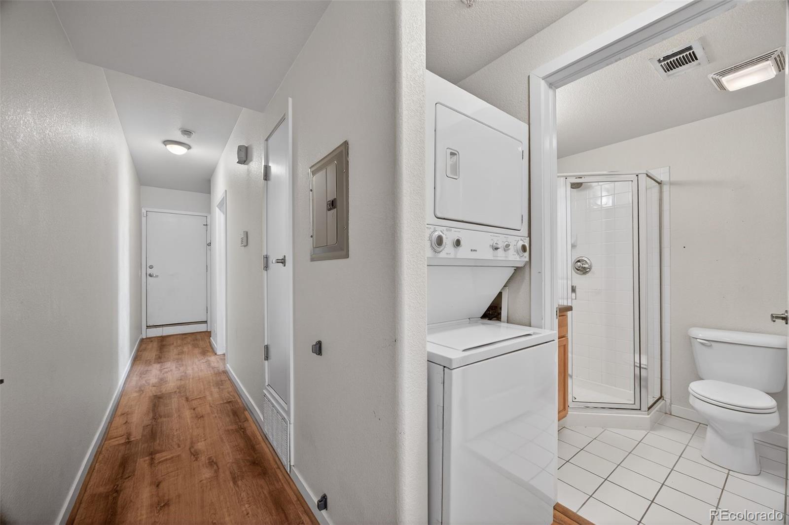 2389 South High Street, Unit 4 Denver, CO 80210 - Photo 14 of 32 a bathroom with a sink a toilet and shower
