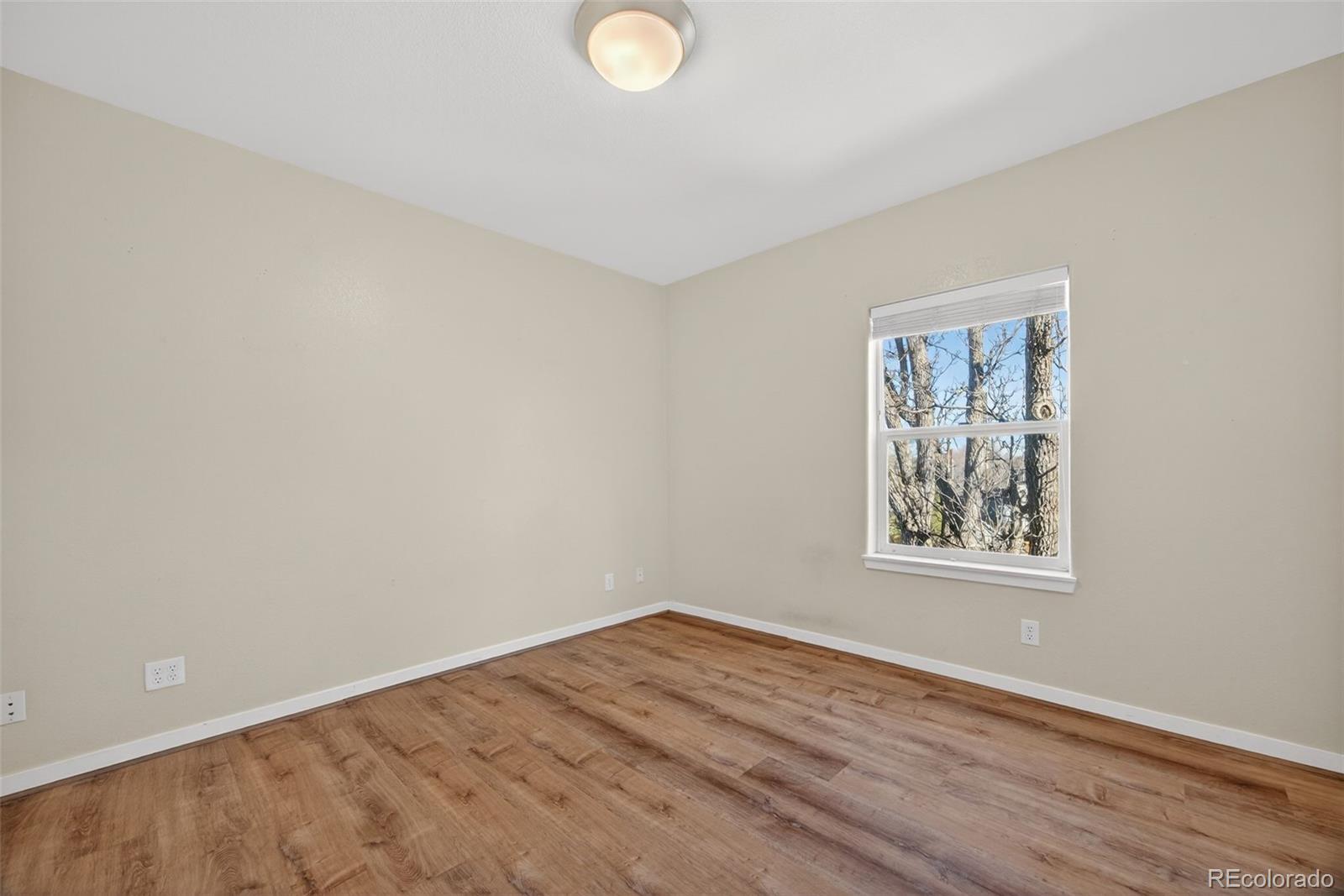 2389 South High Street, Unit 4 Denver, CO 80210 - Photo 18 of 32 a view of empty room with wooden floor