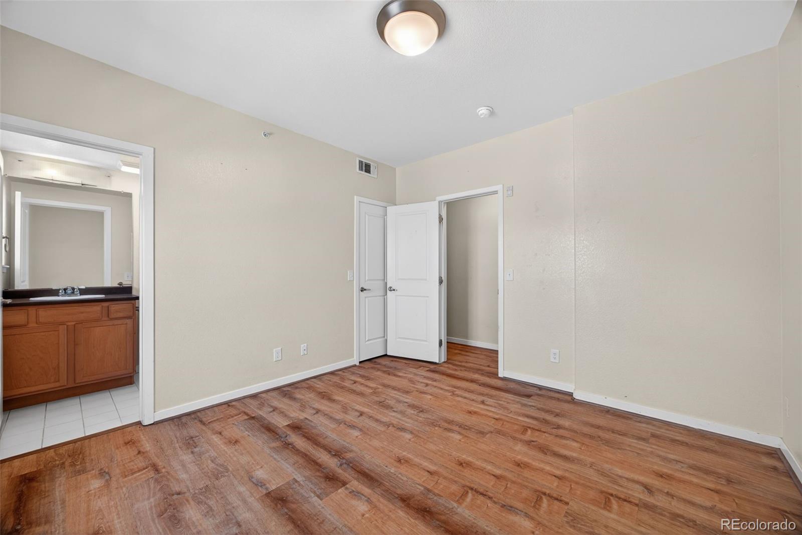 2389 South High Street, Unit 4 Denver, CO 80210 - Photo 19 of 32 a view of a room with wooden floor and a sink