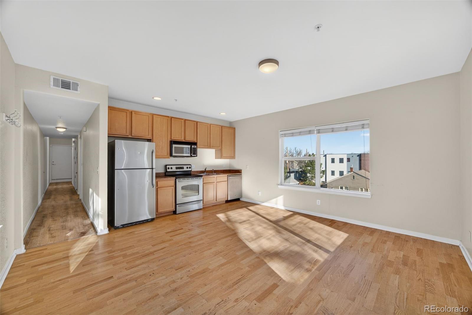2389 South High Street, Unit 4 Denver, CO 80210 - Photo 5 of 32 a view of kitchen with stainless steel appliances refrigerator oven