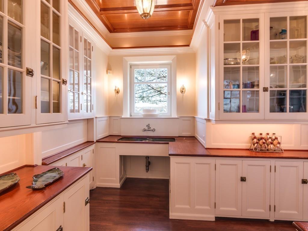 71 Eastern Point Boulevard Gloucester, MA 01930 - Photo 12 of 40 a kitchen with granite countertop white cabinets and window