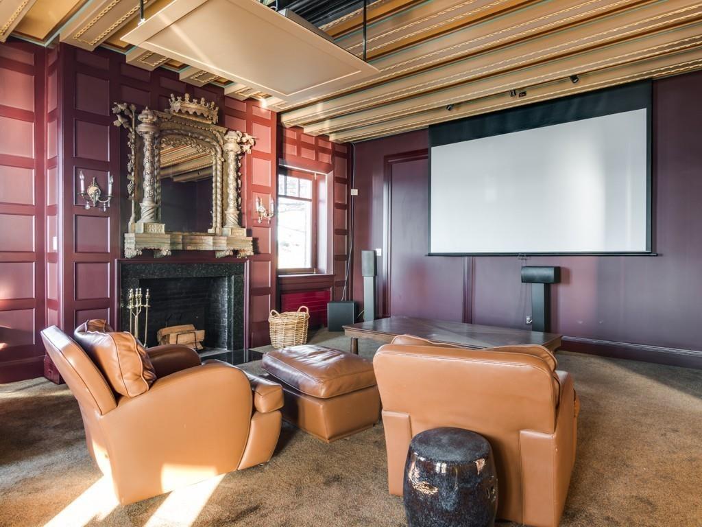 71 Eastern Point Boulevard Gloucester, MA 01930 - Photo 14 of 40 a living room with furniture a fireplace and a flat screen tv