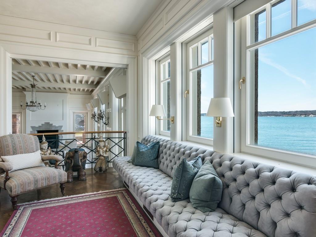 71 Eastern Point Boulevard Gloucester, MA 01930 - Photo 15 of 40 a living room with furniture and a large window