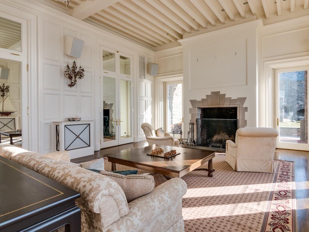 71 Eastern Point Boulevard Gloucester, MA 01930 - Photo 17 of 40 a living room with furniture and a fireplace