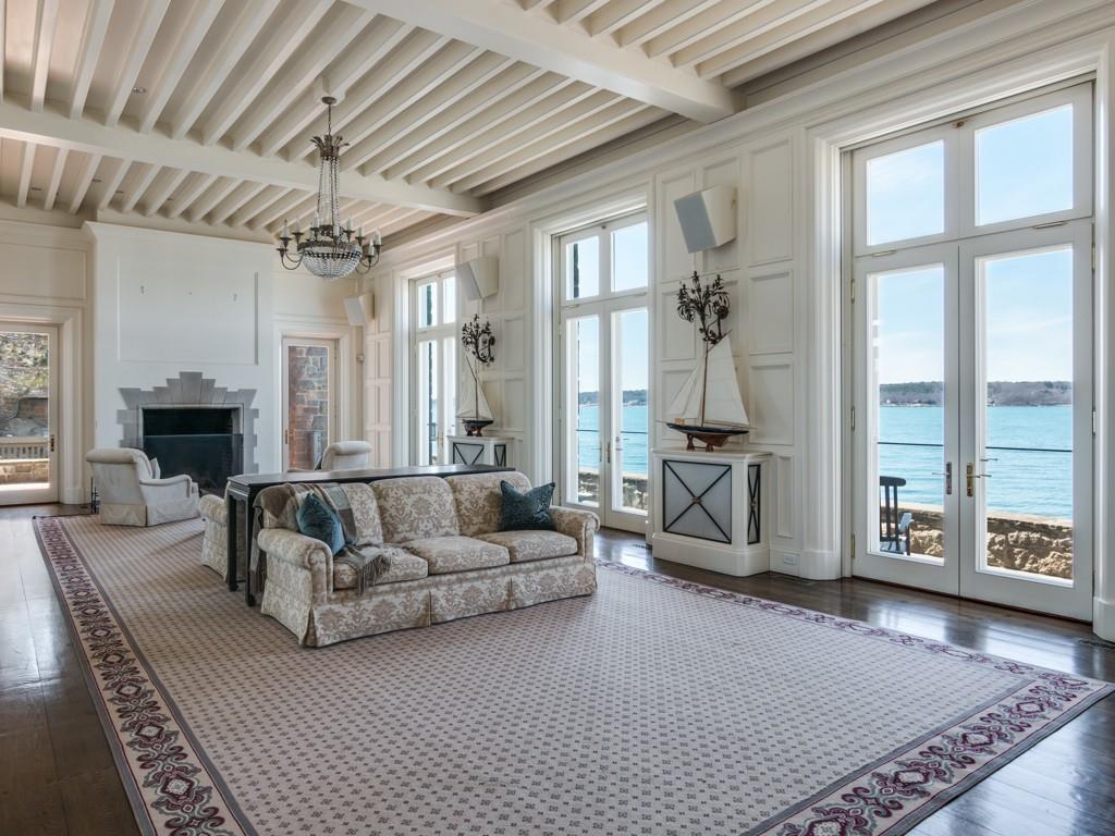 71 Eastern Point Boulevard Gloucester, MA 01930 - Photo 18 of 40 a living room with furniture and a fireplace