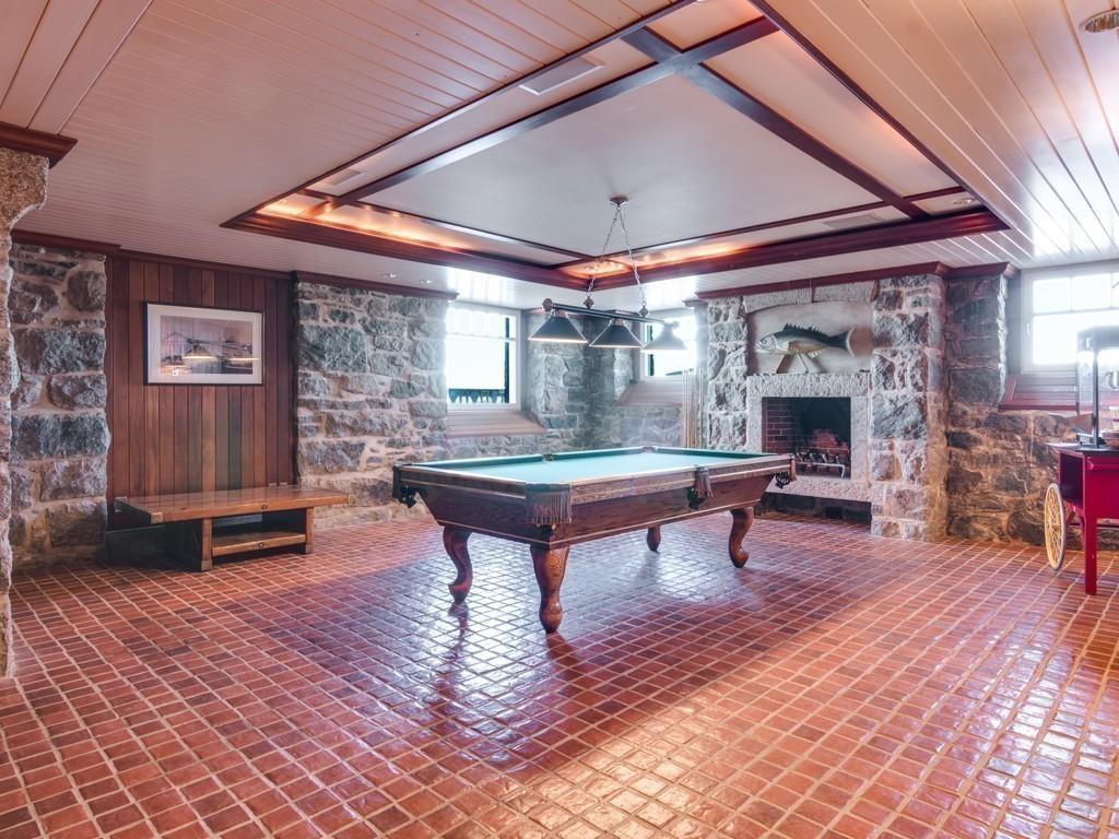 71 Eastern Point Boulevard Gloucester, MA 01930 - Photo 24 of 40 a outdoor space with lots of furniture and a fireplace