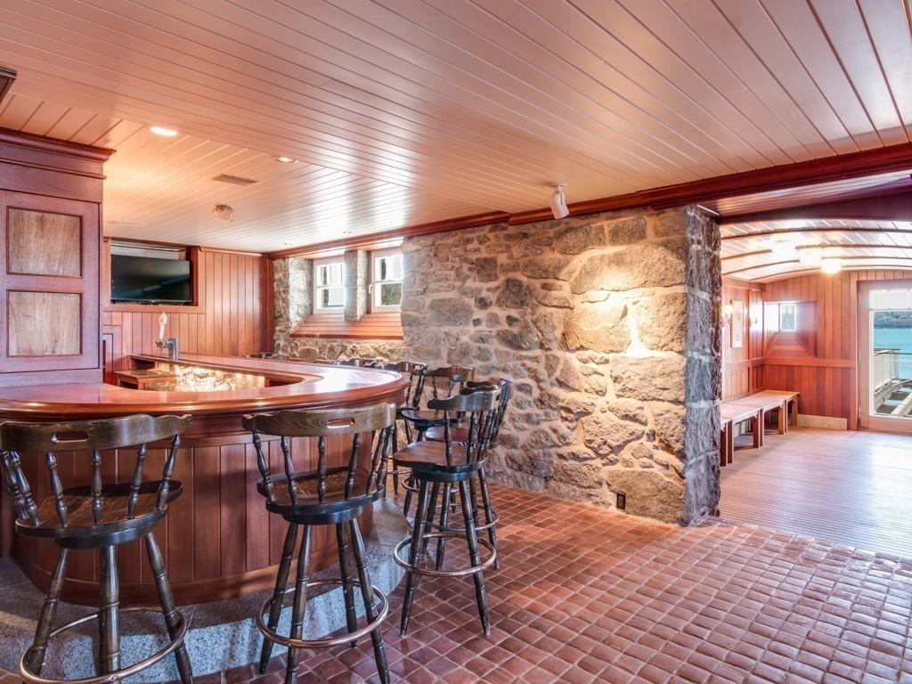 71 Eastern Point Boulevard Gloucester, MA 01930 - Photo 25 of 40 a dinning table and chairs in a room next to a building
