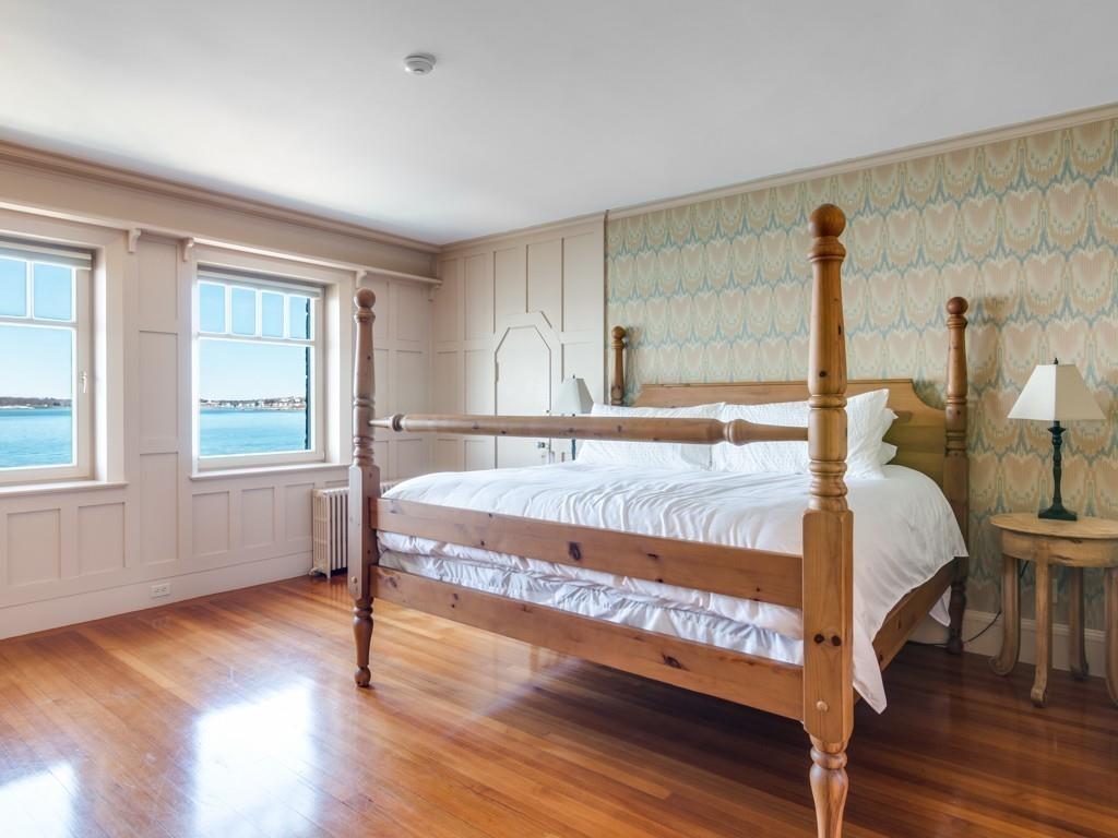 71 Eastern Point Boulevard Gloucester, MA 01930 - Photo 38 of 40 a bedroom with a bed and wooden floor