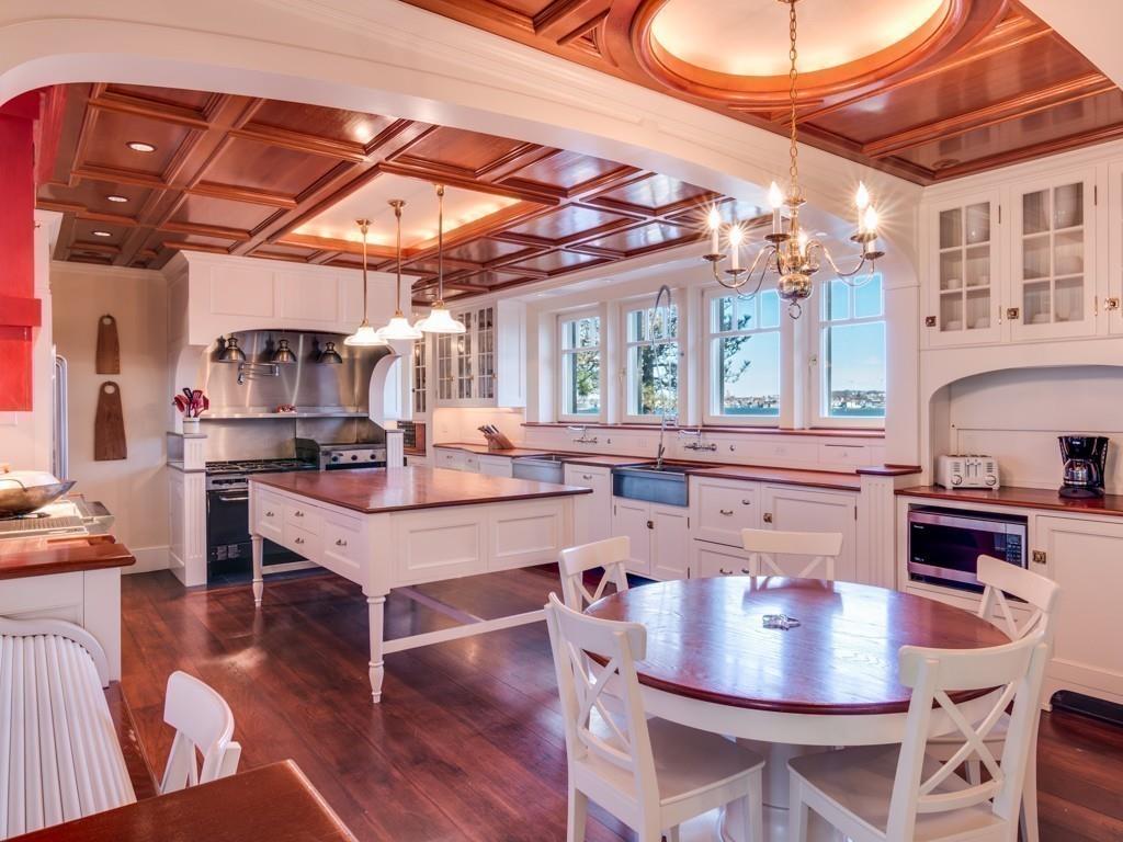 71 Eastern Point Boulevard Gloucester, MA 01930 - Photo 6 of 40 a kitchen with a dining table and chairs