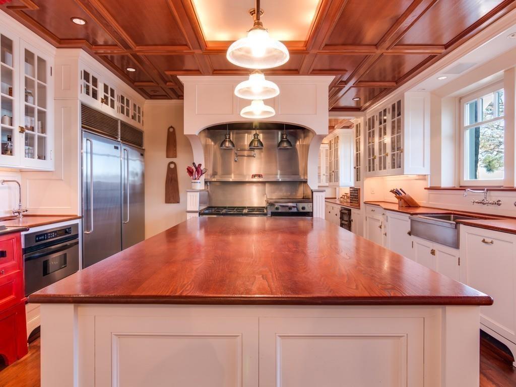 71 Eastern Point Boulevard Gloucester, MA 01930 - Photo 7 of 40 a kitchen with stainless steel appliances granite countertop a sink a stove and a refrigerator