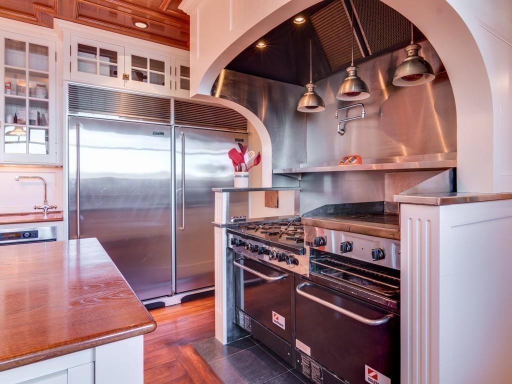 71 Eastern Point Boulevard Gloucester, MA 01930 - Photo 9 of 40 a kitchen with a stove and a refrigerator
