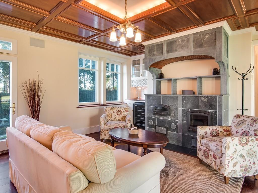 71 Eastern Point Boulevard Gloucester, MA 01930 - Photo 10 of 40 a living room with furniture a fireplace and a table