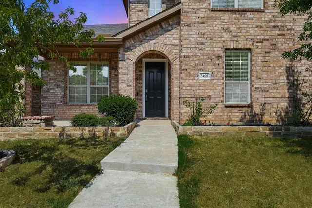 a front view of a house with yard