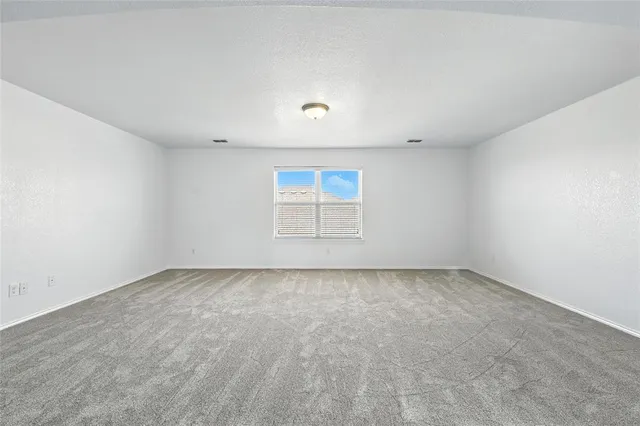 an empty room with a empty space and window