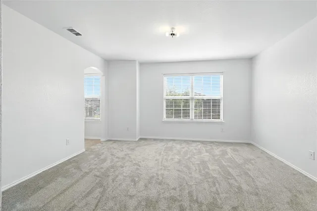 an empty room with windows