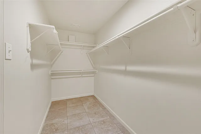 a view of an empty walk in closet