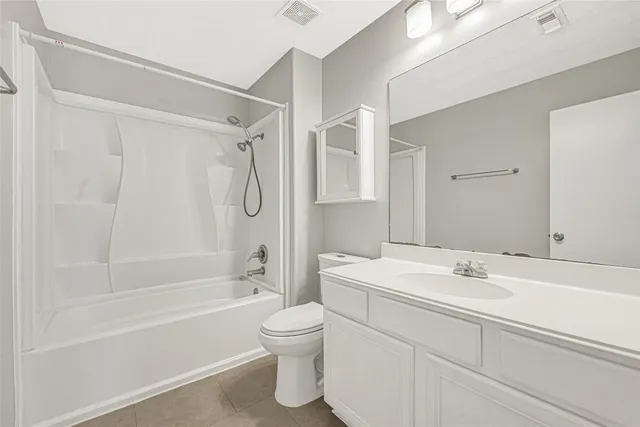 a bathroom with a sink a toilet and a bathtub