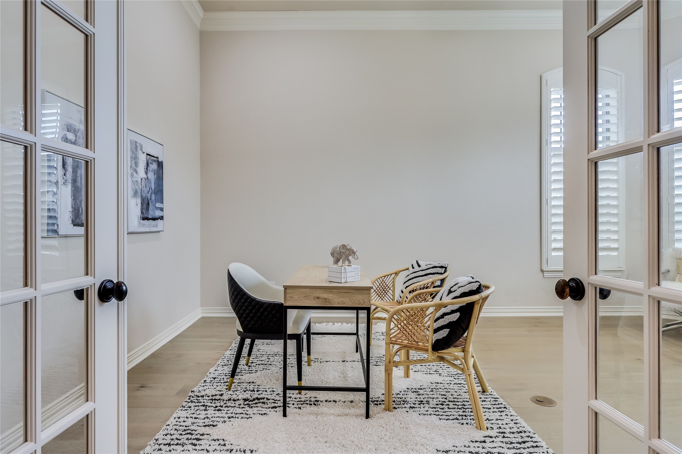 408 Ridgetop Bend Cedar Park, TX 78613 - Photo 18 of 40 French doors open into a bright, contemporary office space with hardwood floors and crown molding.