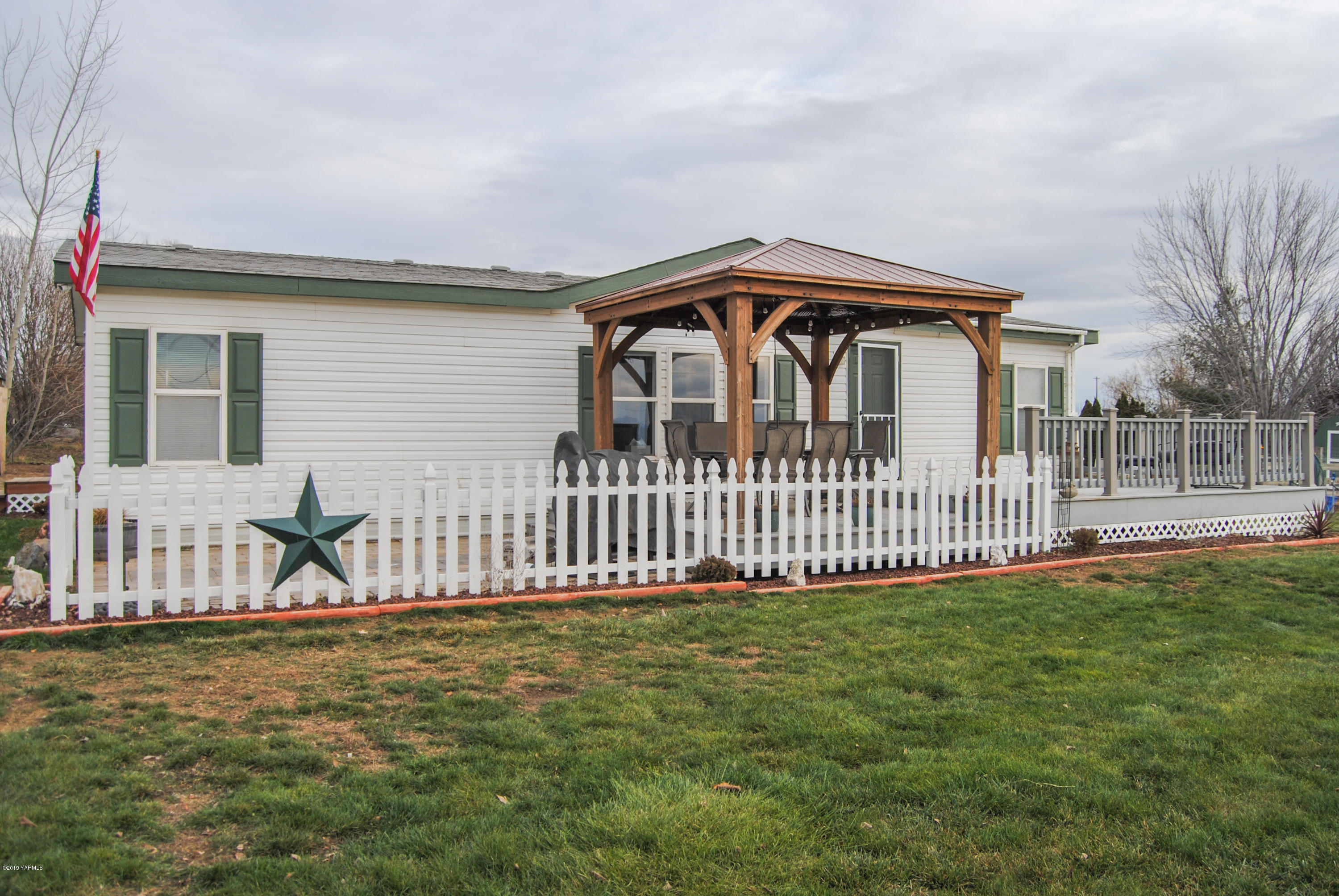 4971 Beam Road Granger, WA 98932 - Photo 1 of 24 a view of a house with a fence