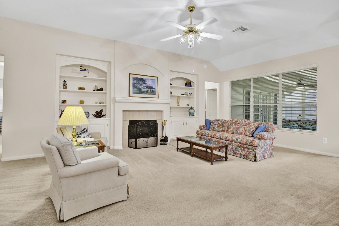 6031 Skyhaven Lane Spring, TX 77379 - Photo 13 of 34 Gas fireplace and built-ins make a cozy Den.