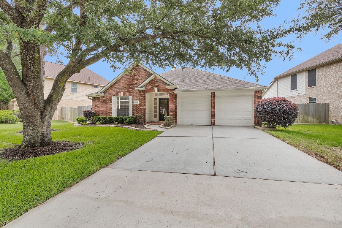 6031 Skyhaven Lane Spring, TX 77379 - Photo 2 of 34 Large trees offer wonderful shade in the afternoons.