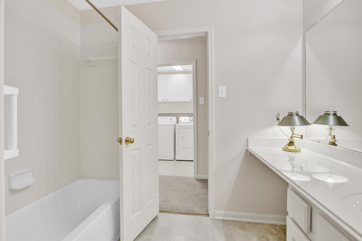 6031 Skyhaven Lane Spring, TX 77379 - Photo 26 of 34 Tub/Shower combination and a vanity area completes this bath.