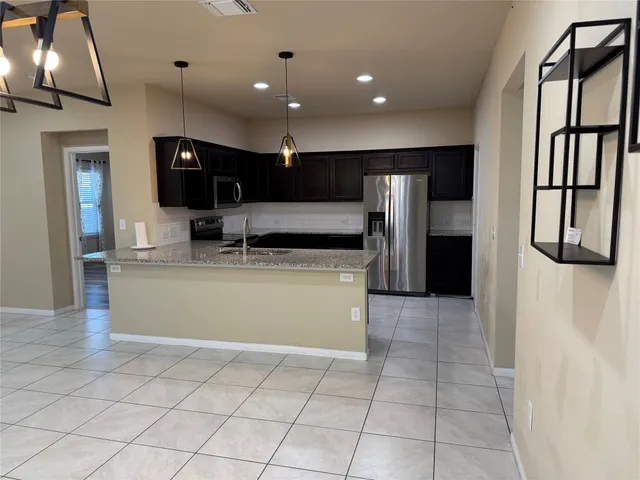 a kitchen with a stove microwave and cabinets