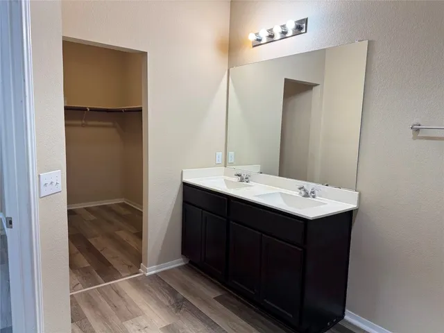 a view of a house with swimming pool in front of it