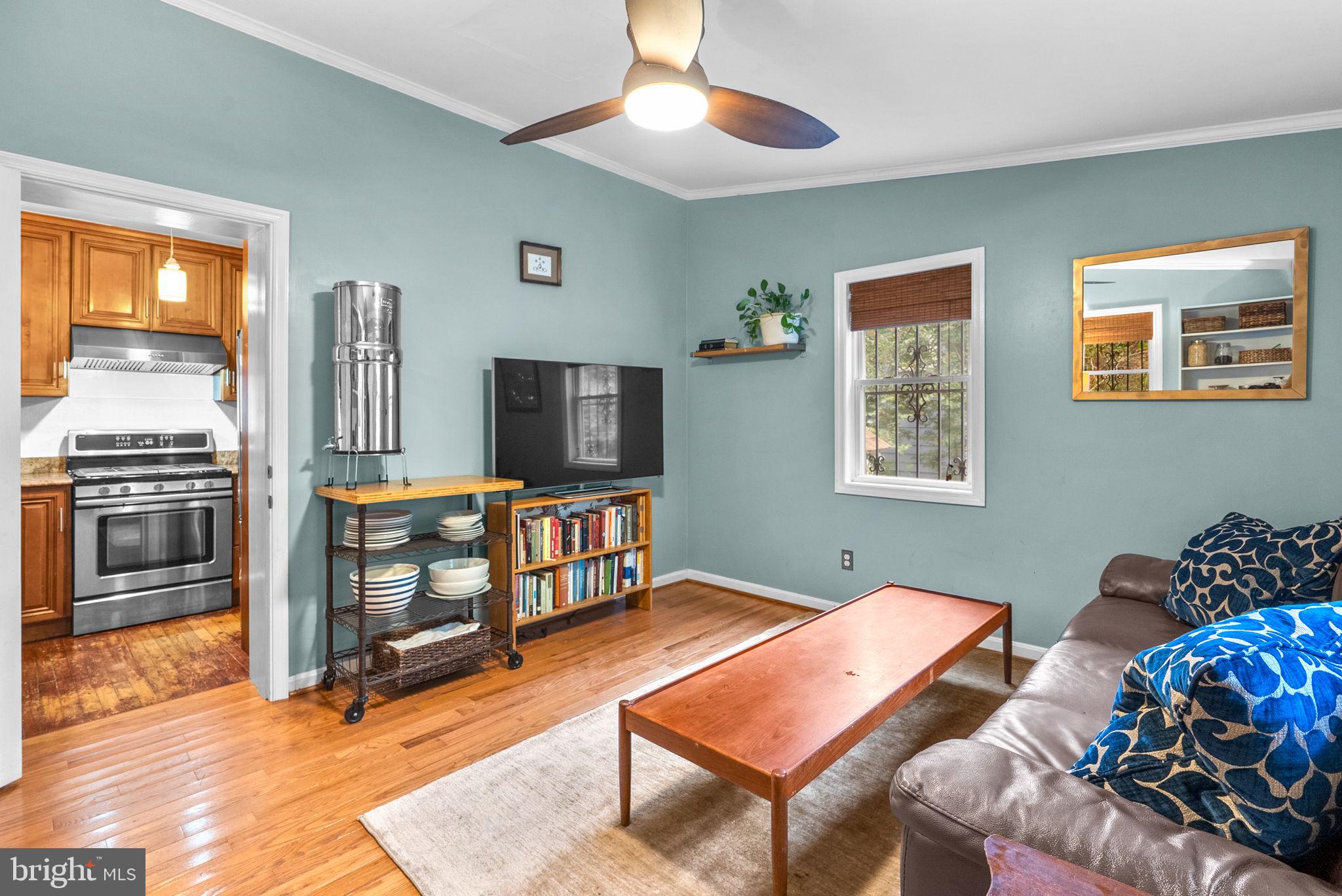 3403 Varnum Street Brentwood, MD 20722 - Photo 11 of 20 a living room with furniture a flat screen tv and a dining table