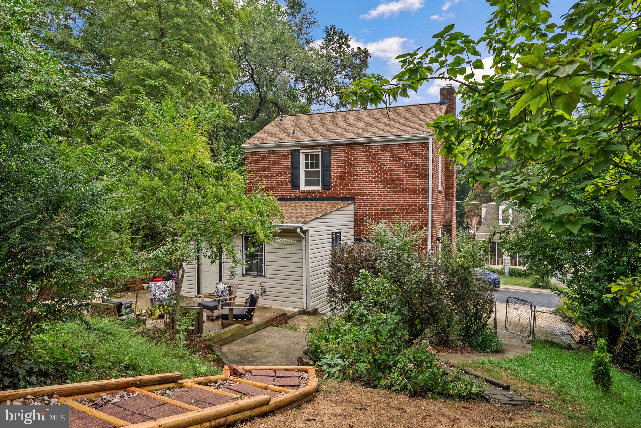 3403 Varnum Street Brentwood, MD 20722 - Photo 2 of 20 a aerial view of a house with swimming pool and garden