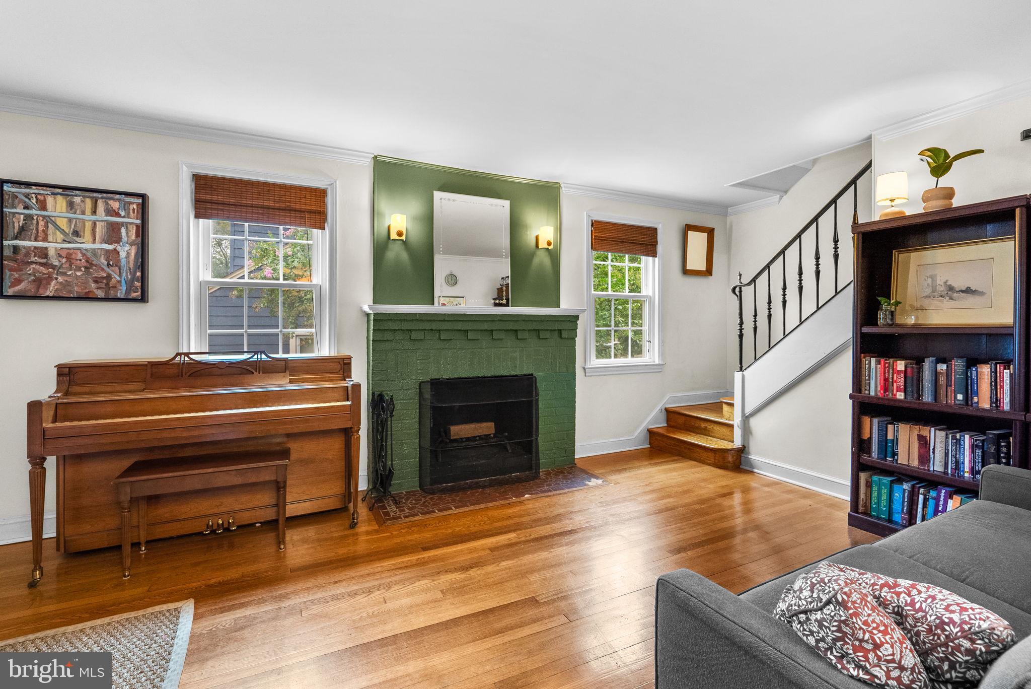 3403 Varnum Street Brentwood, MD 20722 - Photo 5 of 20 a living room with furniture a bookshelf and a fireplace