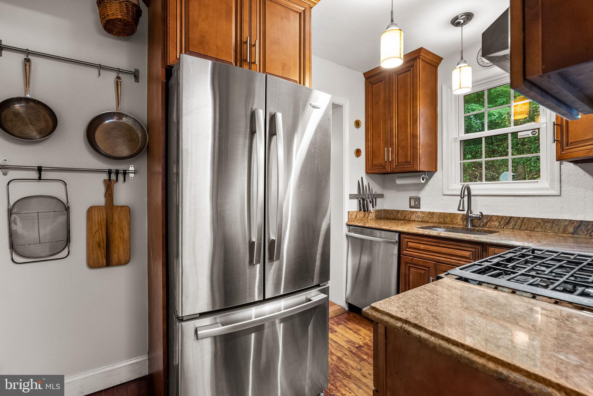 3403 Varnum Street Brentwood, MD 20722 - Photo 7 of 20 a kitchen with a refrigerator and a stove