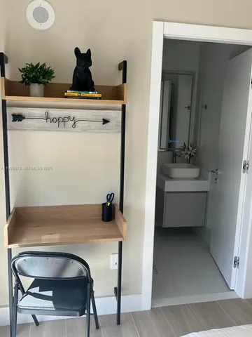 a room with a sink and cabinets