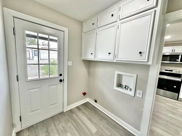 a view of kitchen with furniture and wooden floor