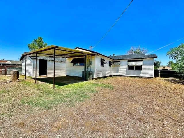 a house with swimming pool in front of it