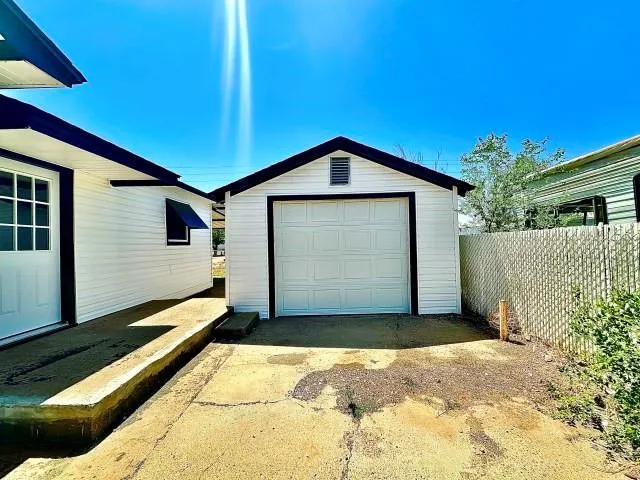 a front view of a house with a garage