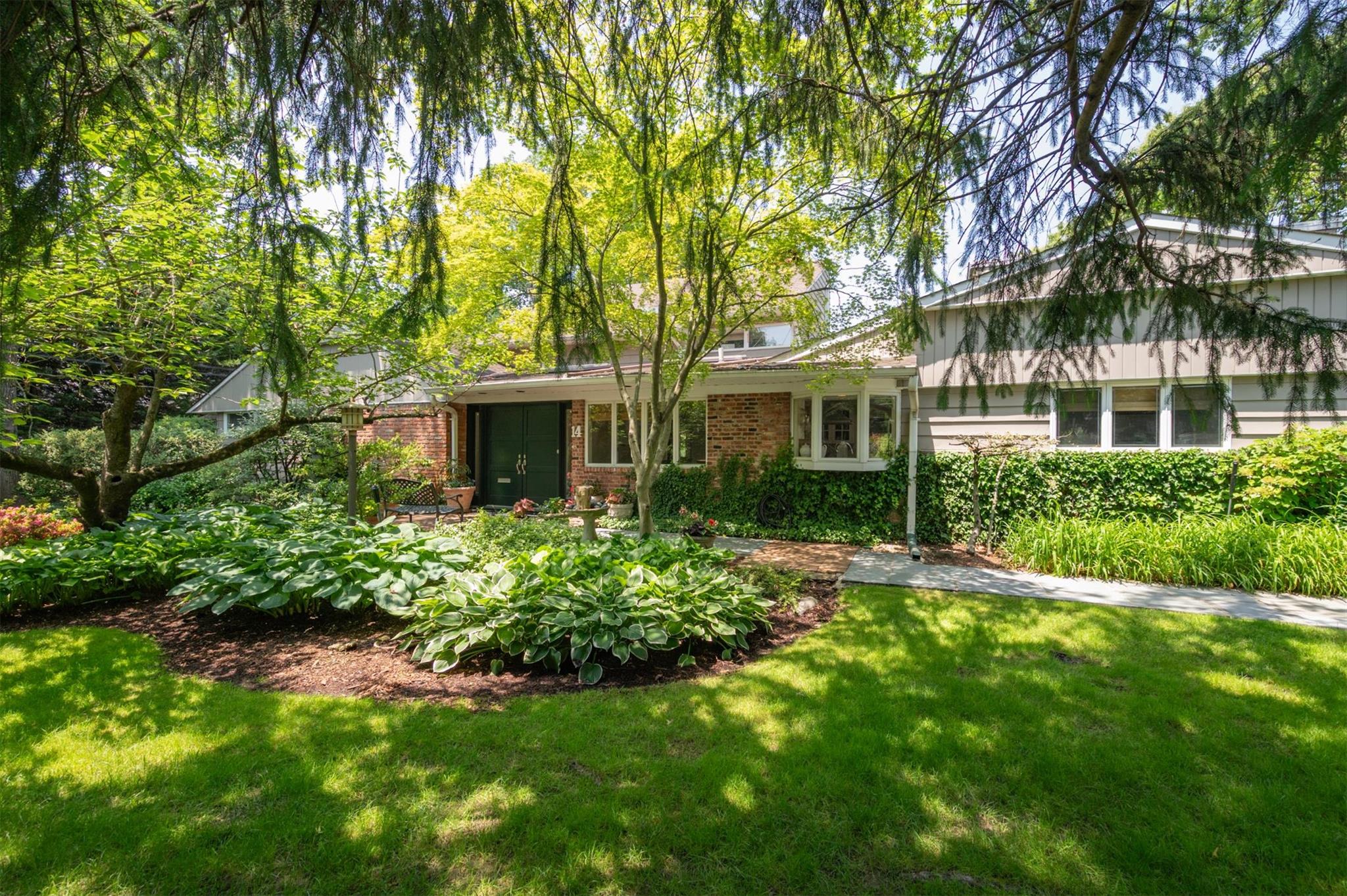 14 Old Farm Road Great Neck, NY 11020 - Photo 1 of 1 View of front of property featuring brick siding and a front yard