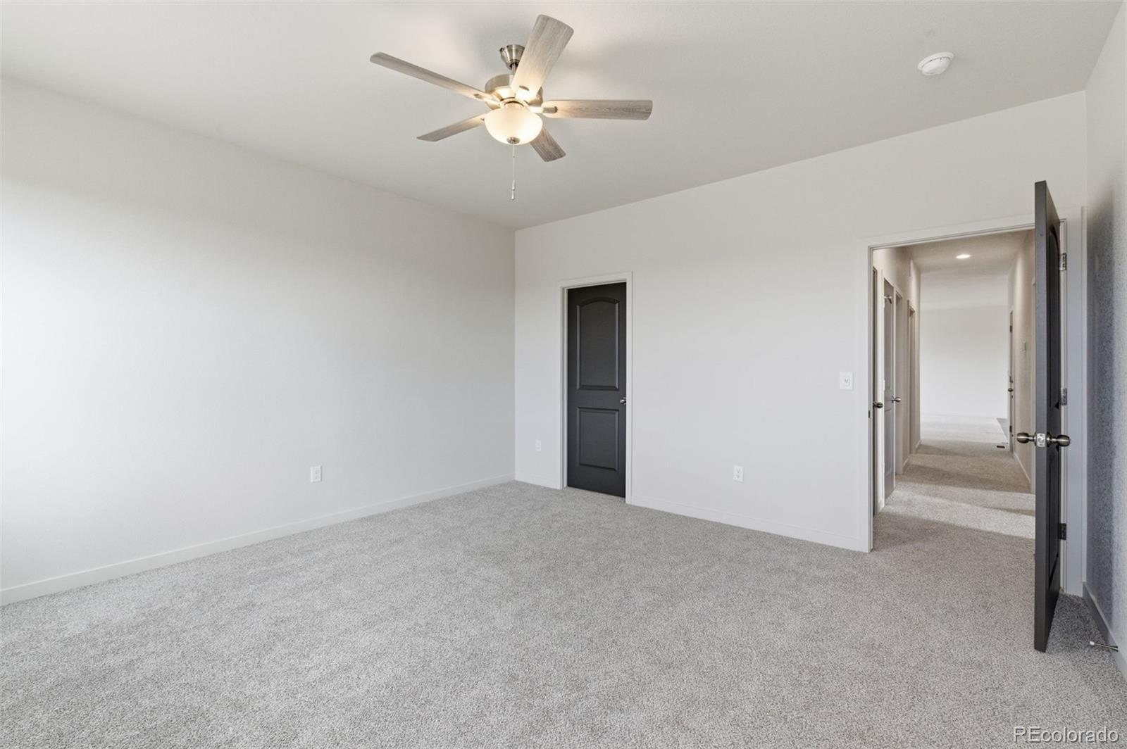 24615 Big Springs Road Pueblo West, CO 81007 - Photo 20 of 24 a view of an empty room with a ceiling fan