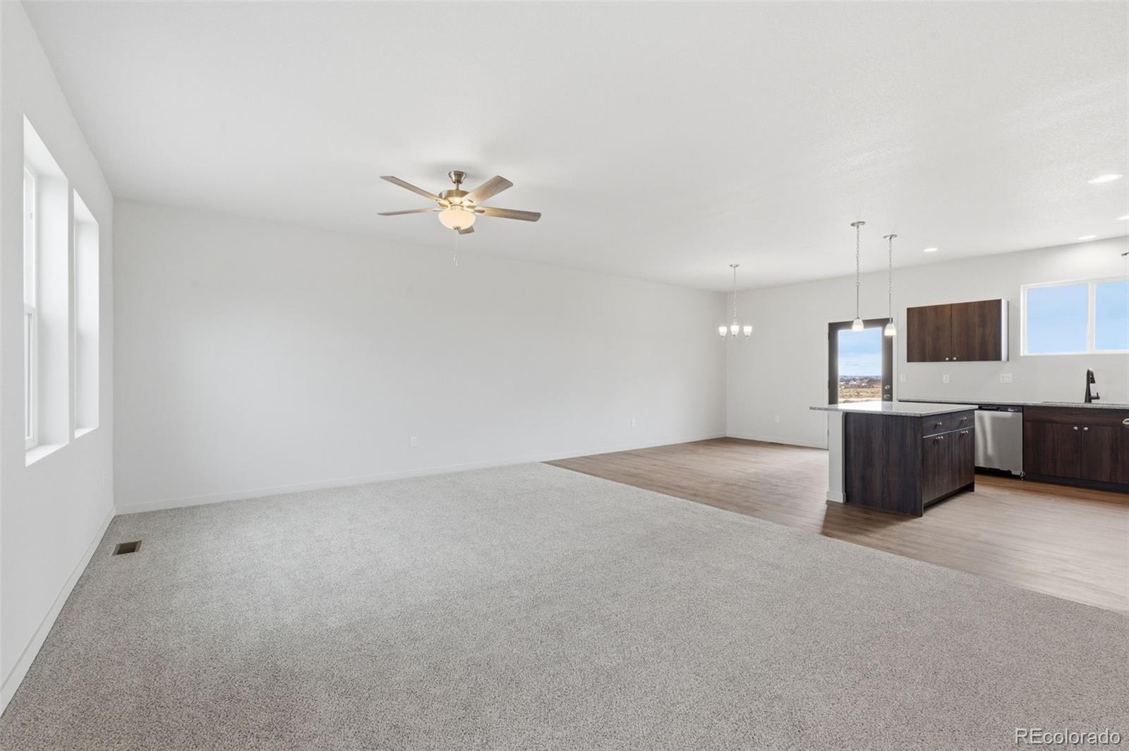 24615 Big Springs Road Pueblo West, CO 81007 - Photo 2 of 24 a view of kitchen with a sink a refrigerator and window