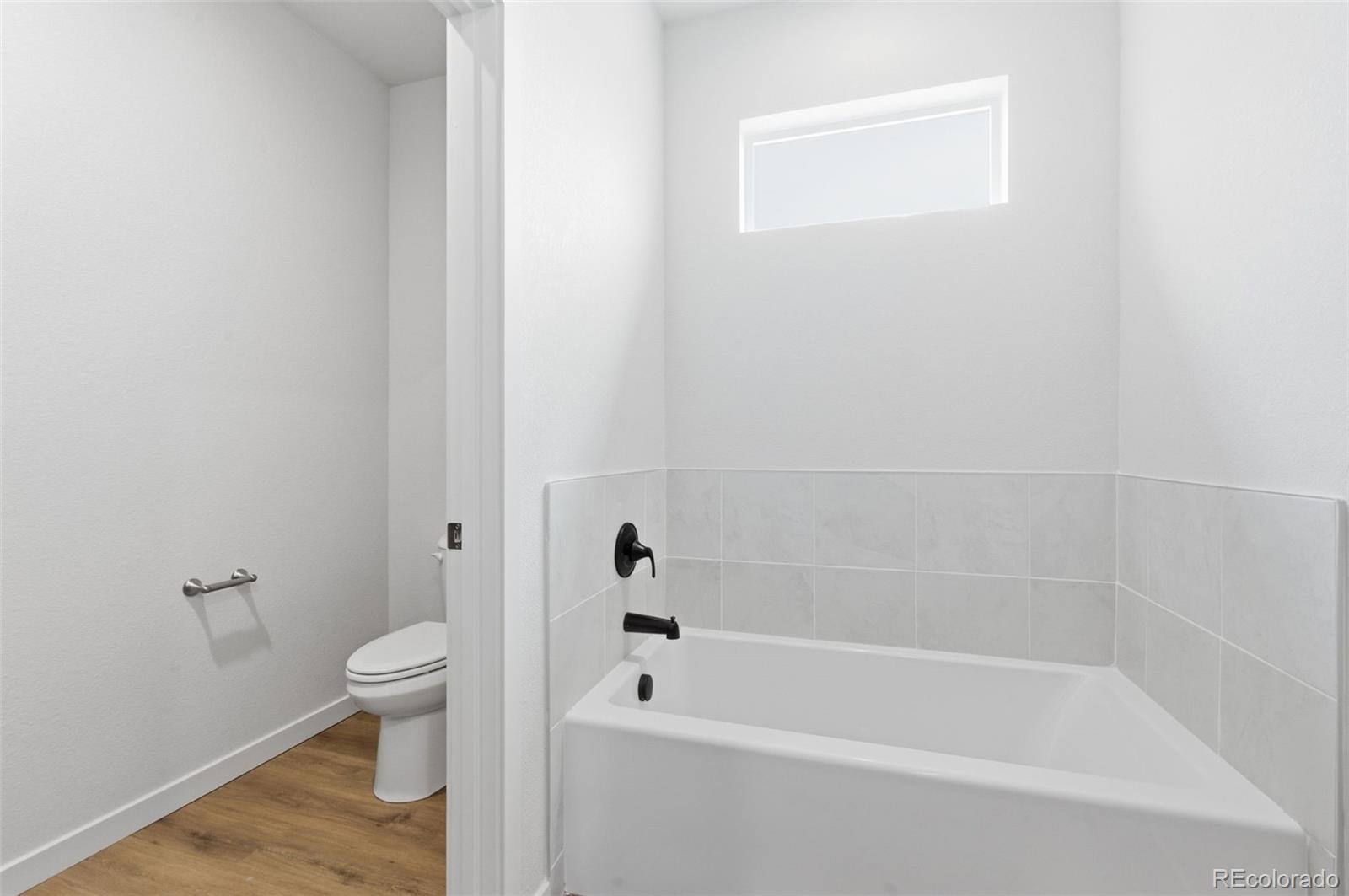 24615 Big Springs Road Pueblo West, CO 81007 - Photo 23 of 24 a white bath tub sitting next to a white toilet