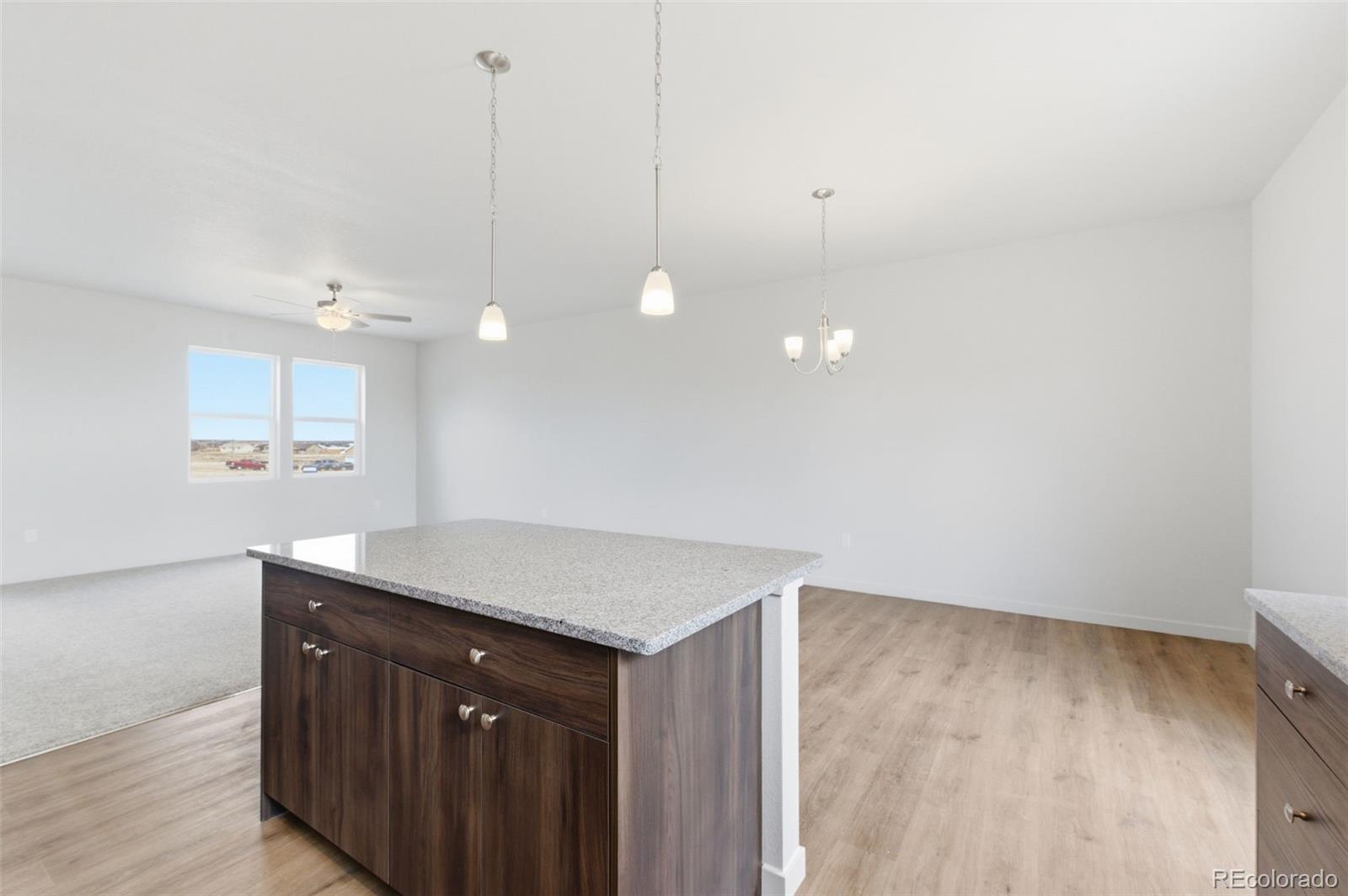 24615 Big Springs Road Pueblo West, CO 81007 - Photo 8 of 24 a kitchen with a sink a counter space and a window