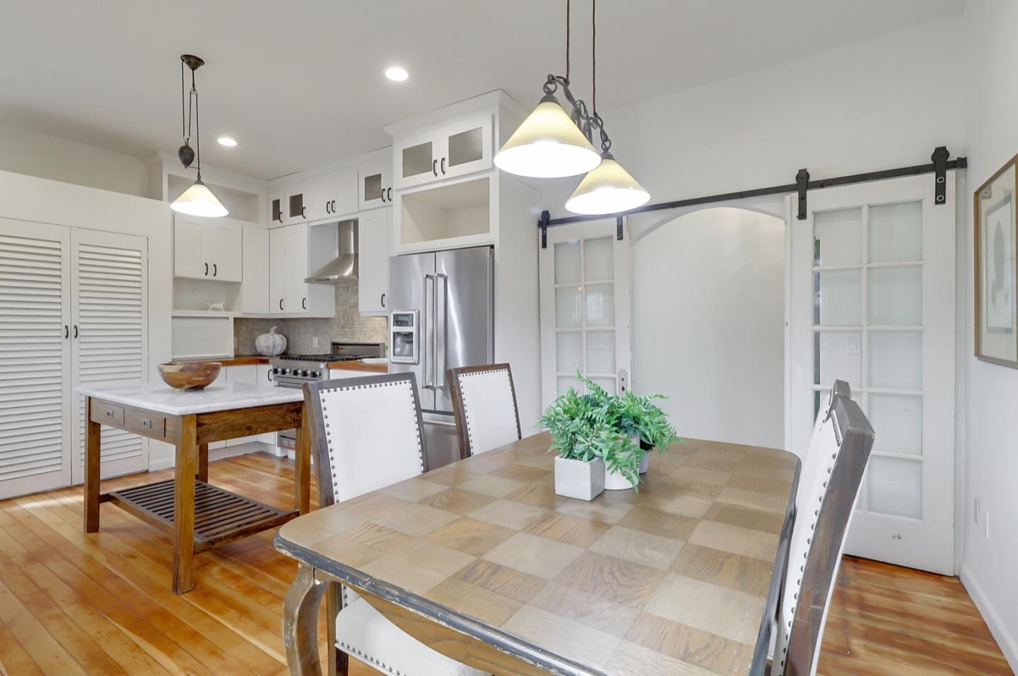 2614 Etna Street Berkeley, CA 94704 - Photo 20 of 59 a kitchen with refrigerator and wooden floor