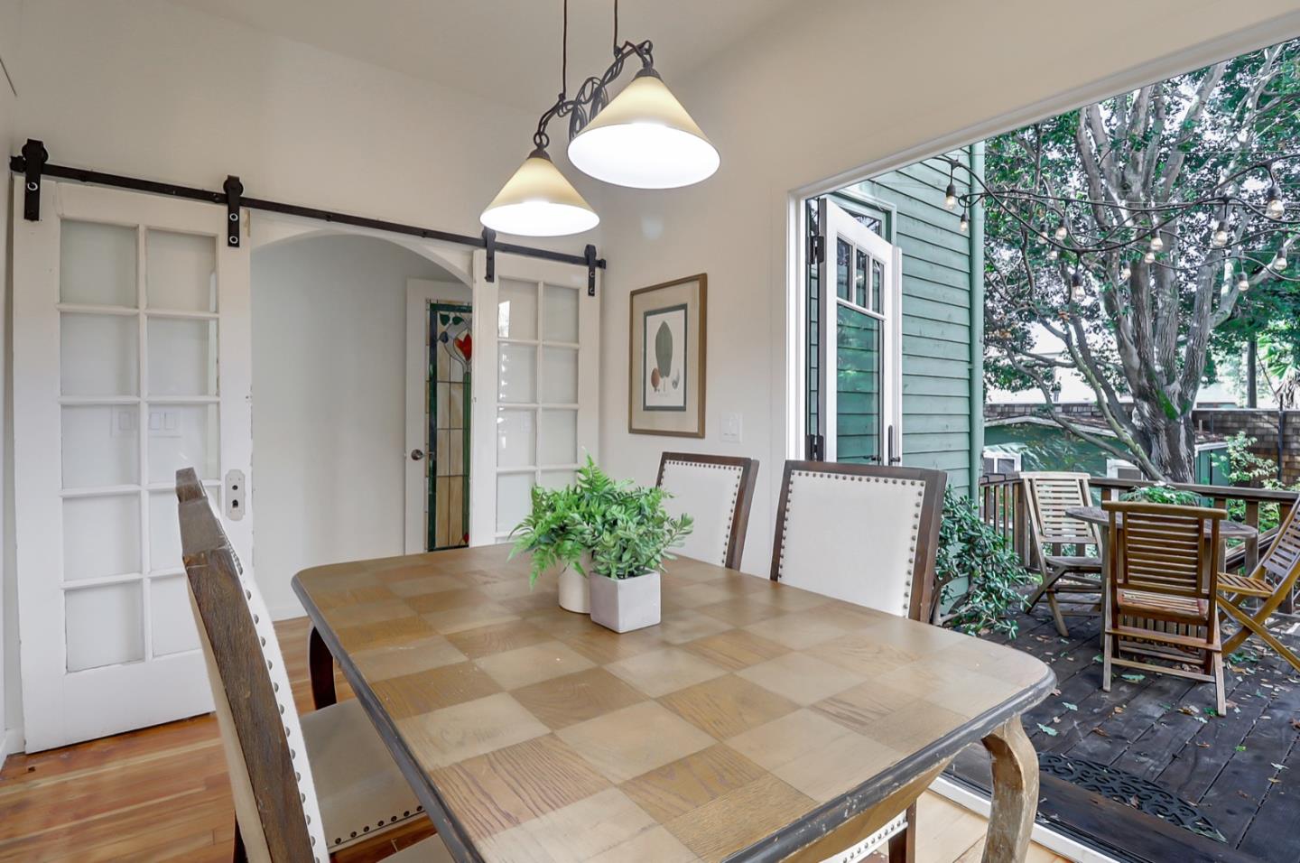 2614 Etna Street Berkeley, CA 94704 - Photo 21 of 59 a view of a dining room with furniture window and wooden floor