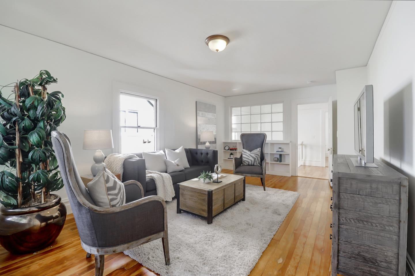 2614 Etna Street Berkeley, CA 94704 - Photo 24 of 59 a living room with furniture and a large window